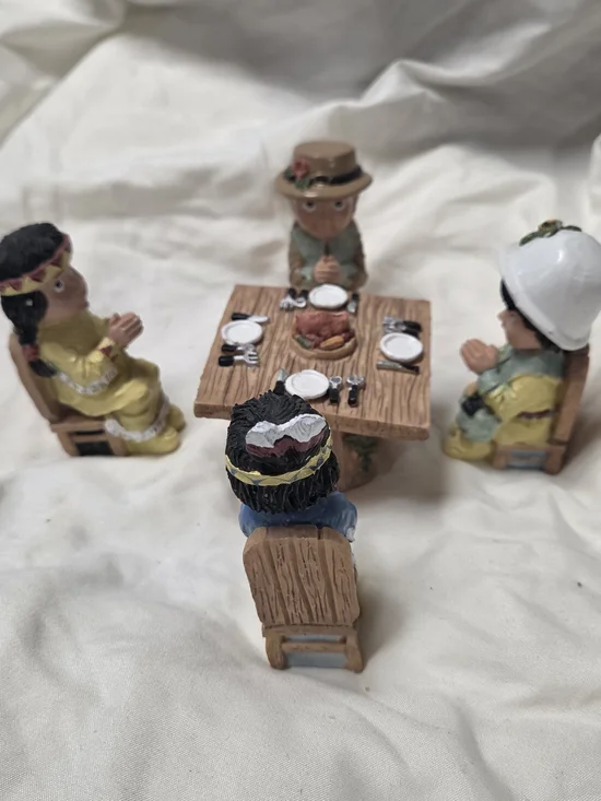vintage miniature Thanksgiving figurines depicting praying Pilgrim And Native
