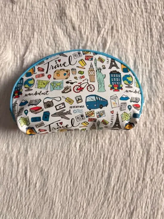 Travel-themed makeup bag/pencil pouch blue trim and travel-related illustrations