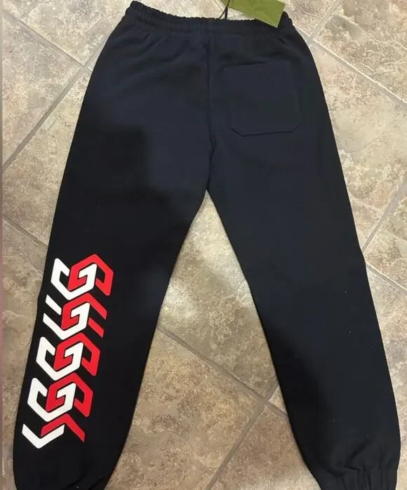 Men's Gucci cotton red/white logo sweatpants size extra small fits small/medium