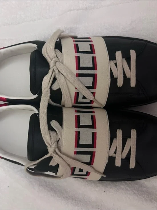 Gucci Black Leather Sneakers with Cream Strap and Red Accent