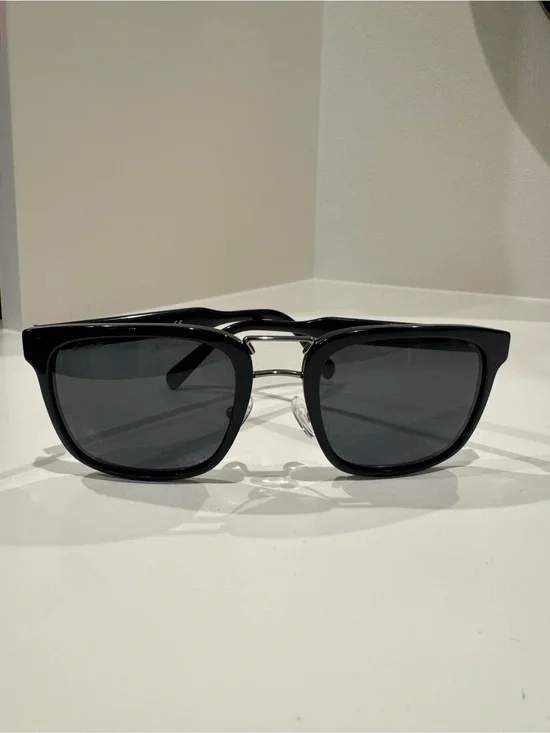 Prada SPR 14T Black unisex sunglasses with silver accents.