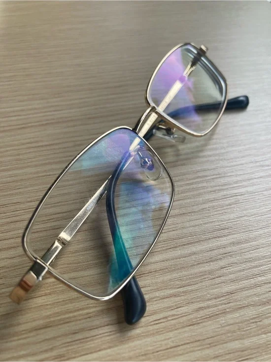 Gold Rim Rectangular Glasses with Blue Lens Reflection