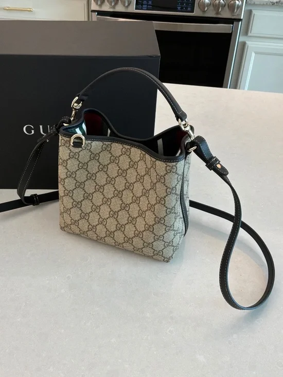 GUCCI GG Emblem small bucket bag