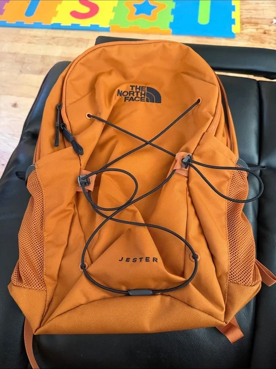 The North Face Jester Backpack in burnt orange with black accents