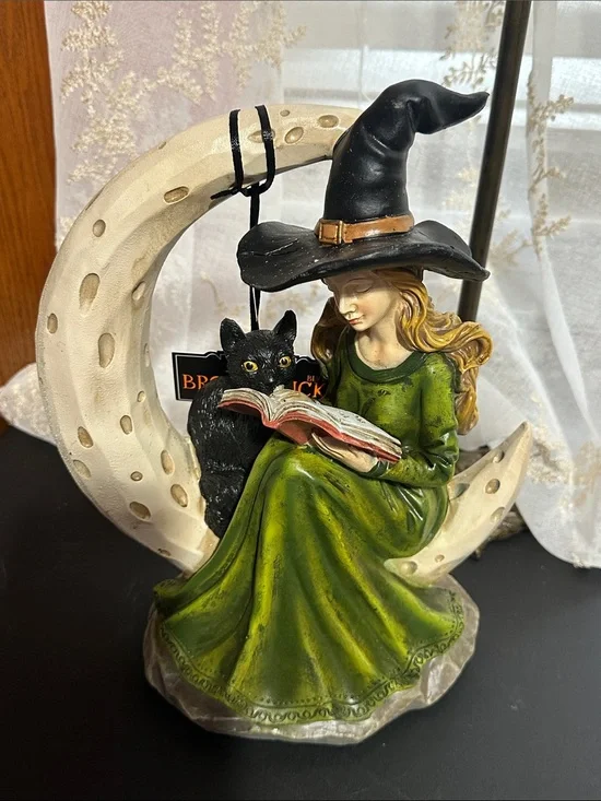 Broomstick blvd Halloween witch sitting on crescent moon