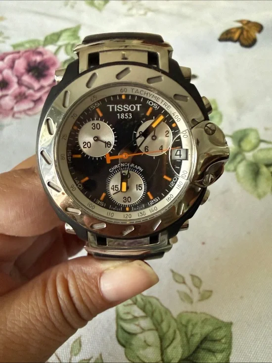 Tissot Black Dial Chronograph Watch with Silver Case and Orange Accents