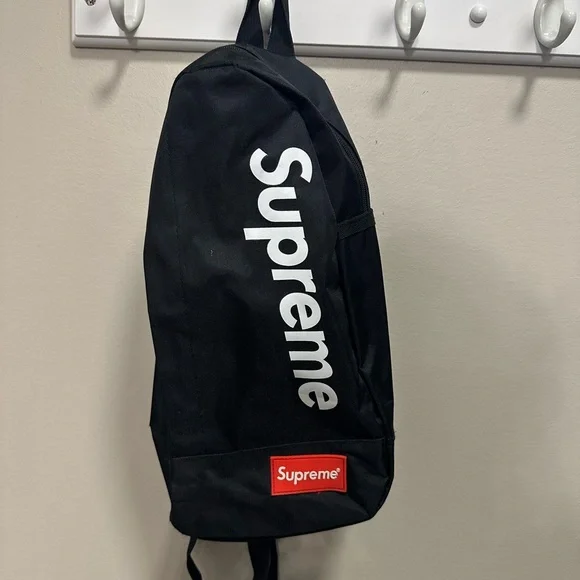 Supreme Black Backpack with White Logo and Red Patch