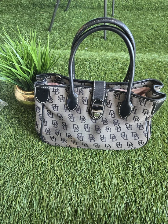 Dooney & Bourke Beige and Black Monogram Satchel with Buckle Accent
