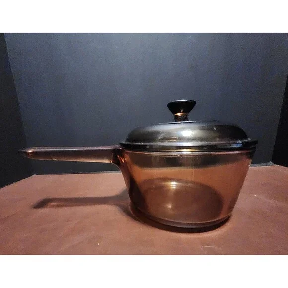 This item appears to be a vintage Corning Visions amber glass 1-liter...