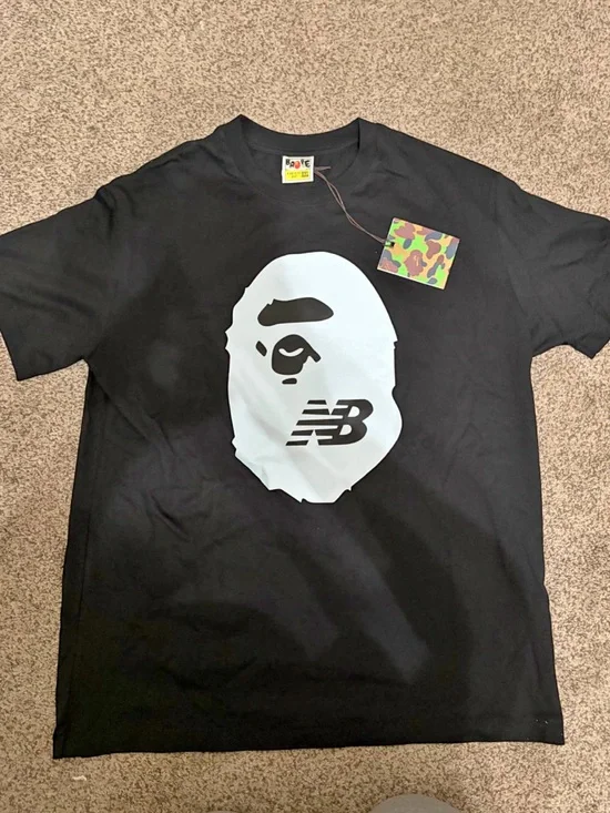 New Balance x BAPE Black Tee with Large White Ape Face Graphic