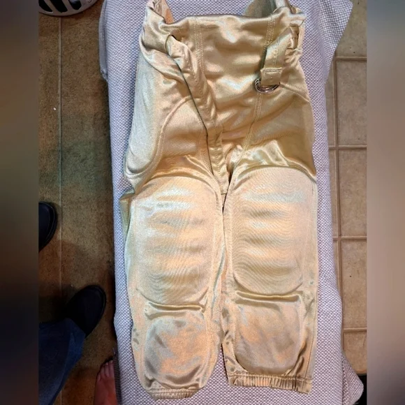 Champro Gold football pants in an adult small. EUC