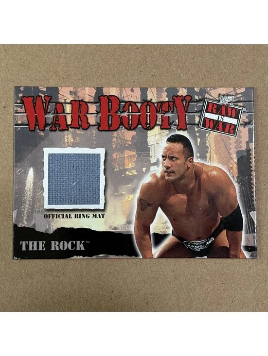 2001 Fleer WWF Raw Is War The Rock #NNO War Booty Mat Relic