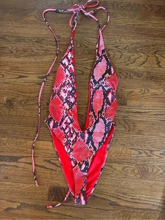 New with no tags. Never worn. Red Snake-Print One-Piece Bodysuit