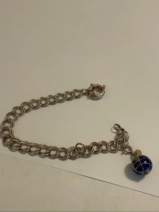 Sterling silver charm bracelet with world charm