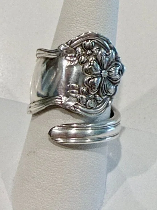 Spoon ring features an ornate floral design