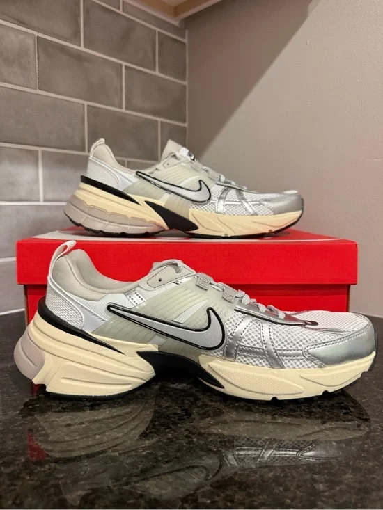 Size 11 Women’s or 9.5 Men’s Nike Silver and Cream Mesh Running Sneakers