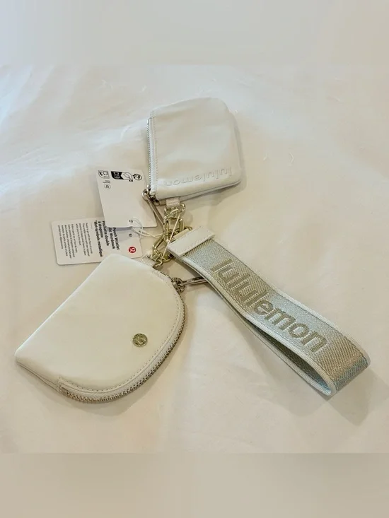 NWT Lululemon Dual Pouch Wristlet Metallic Wordmark Light Ivory Gold Cream