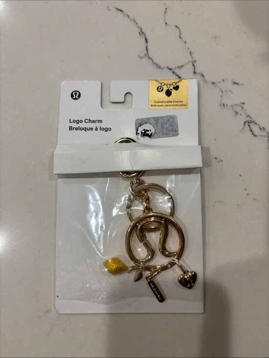 lululemon from Australia RARE Gold Logo 3 Charm Set NWT