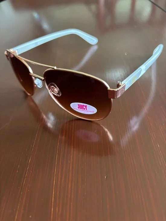 Juicy Coutture 100% UVA-UVB protect,brown gradient lens,gold frame,white arms