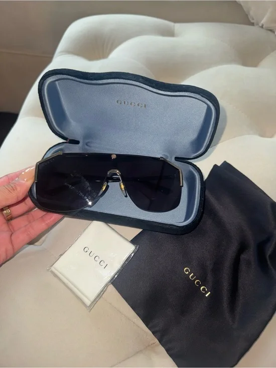 Gucci Black Shield Sunglasses with Gold Accents
