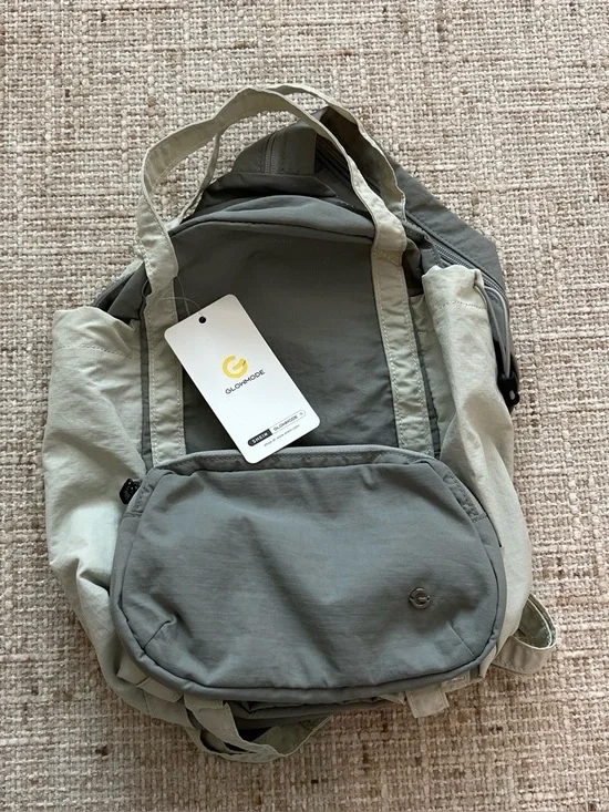 Glowmode gray backpack with detachable pouch and separate zip strap