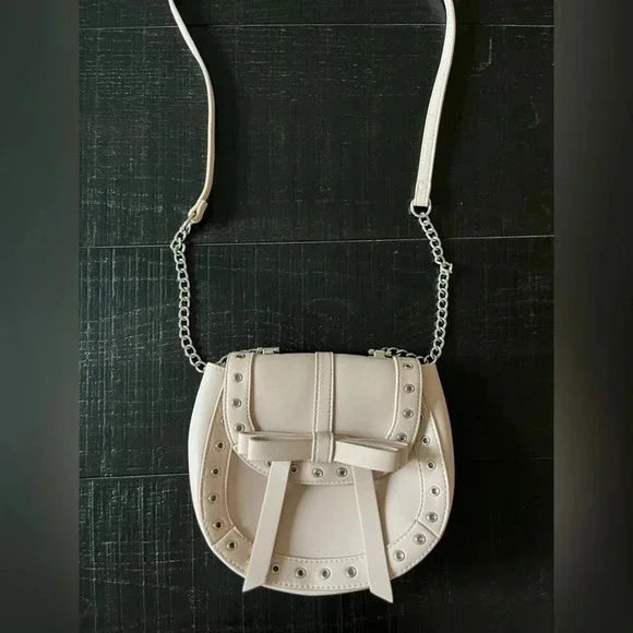 Express Cream Grommet Bow Crossbody Bag