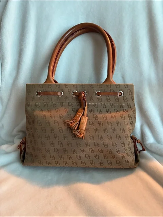 Dooney & Bourke  Brown Monogram Handbag with Tassel Accent