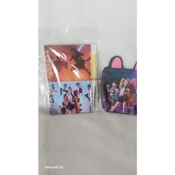 Be on the KPOP scene with Rumi, Mira, & Zoey. With this Notebook and Coin purse