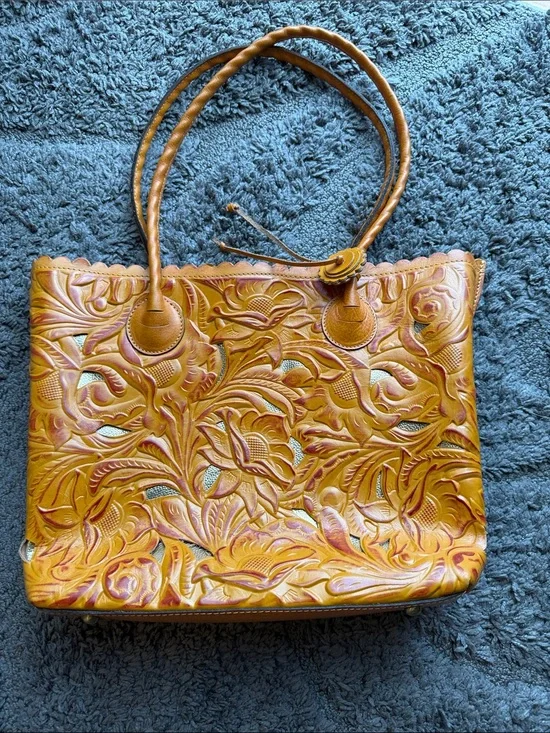 Adeline tote in a cognac burnished cutout tooled leather