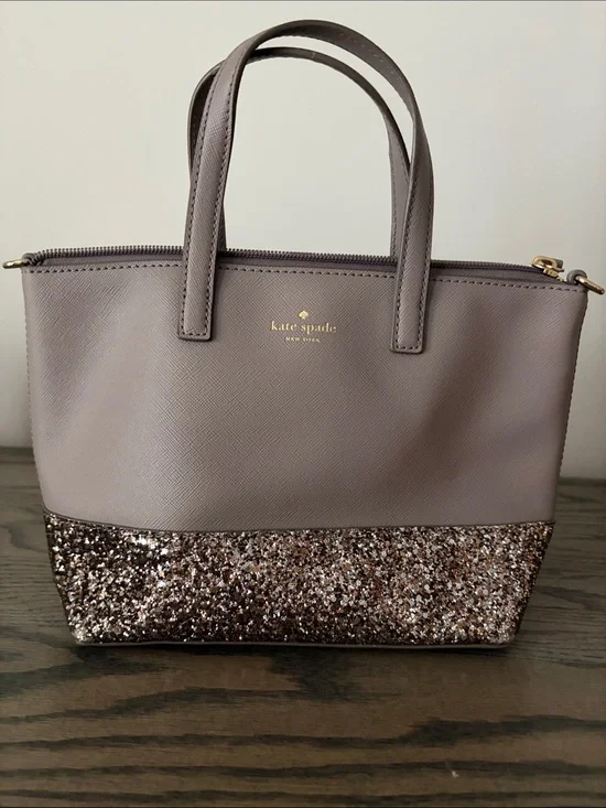 kate spade mauve tote with glitter bottom and gold logo