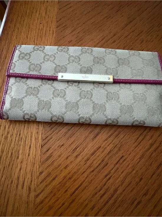Authentic Gucci Beige Monogram Wallet with Pink Trim.