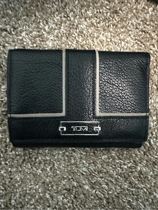 Tumi Black Leather Wallet with Light Trim and Metal Logo