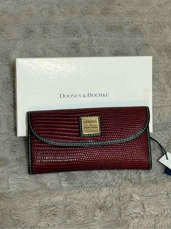 Dooney & Bourke Burgundy Textured Clutch Wallet with Gold Plaque