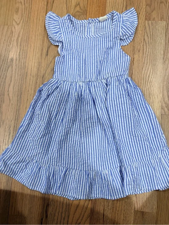 Toddler girl seersucker dress with buttons on the back and ruffle sleeves
