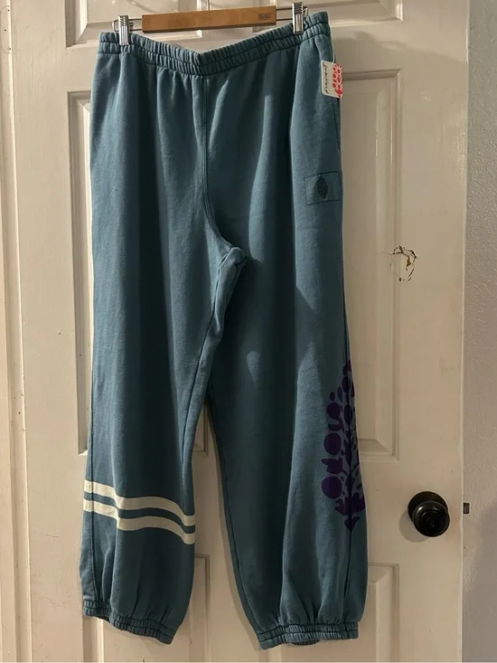 Free People Teal Sweatpants with White Stripe and Purple Graphic