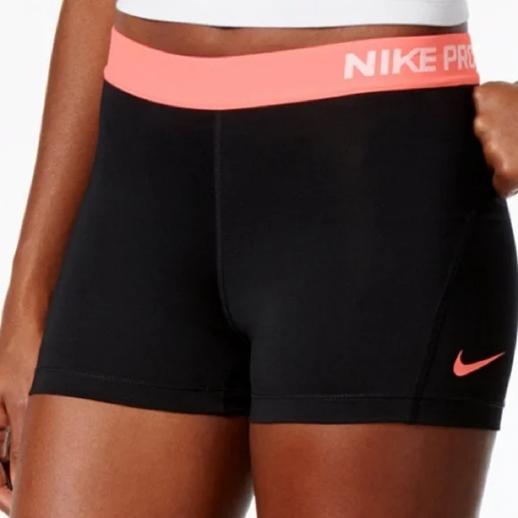 Nike Pro women’s 4” short DRI FIT black and light orange color size L EUC