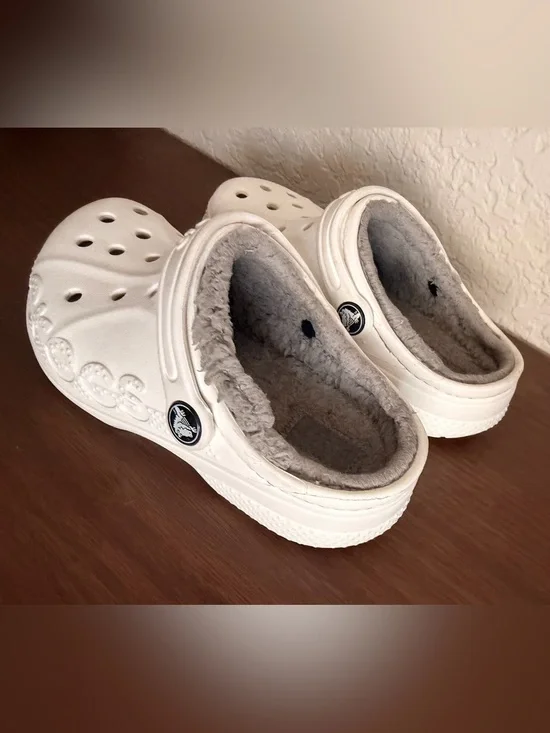 white Crocs Baya Lined Clogs featuring a cozy grey faux-fur lining. C-12