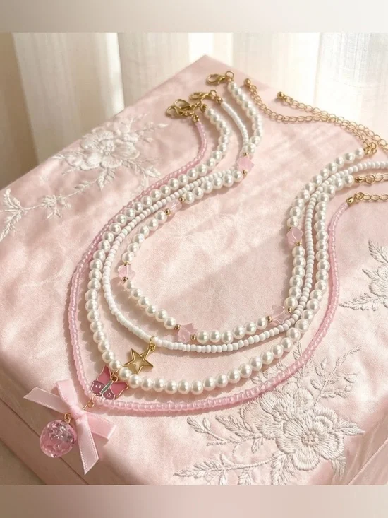 Triple-Strand Pearl Necklace with Pink Accents and Gold Star