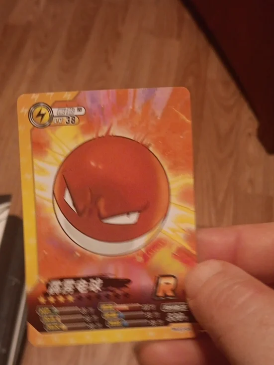 Pokemon Voltorb Trading Card - Red and Yellow Artwork