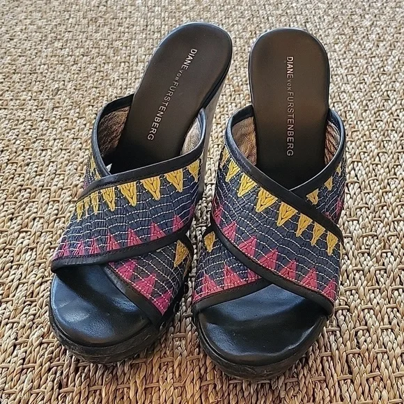 Diane Von Furstenberg wedge sandals.  Textile strap, wood heel.