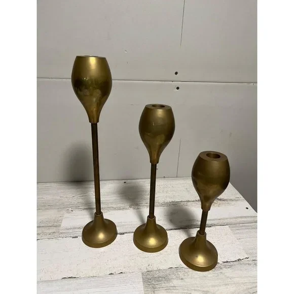 Set of three solid brass candlesticks