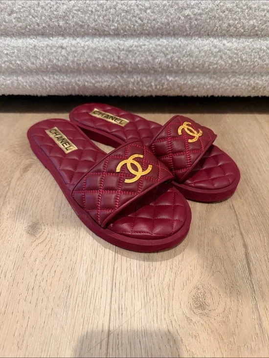 CHANEL Quilted Burgundy Slide Mules with Gold CC Emblem