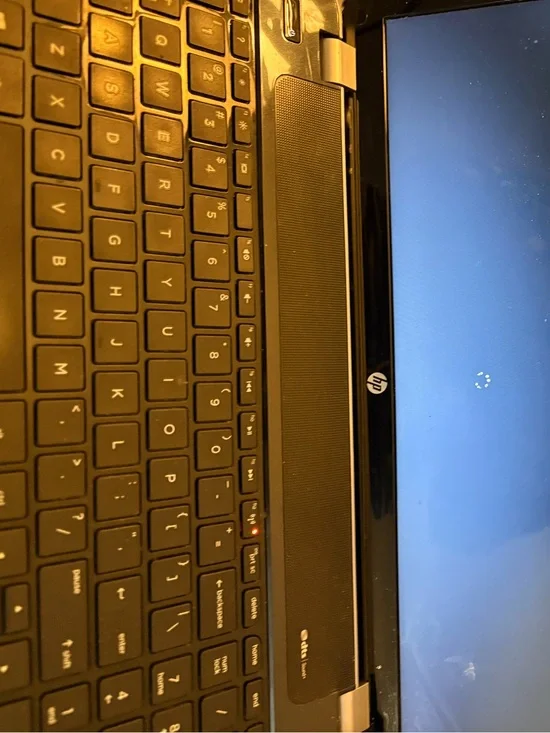 HP Black Laptop with Glossy Black Bezel and Matte Black Keyboard