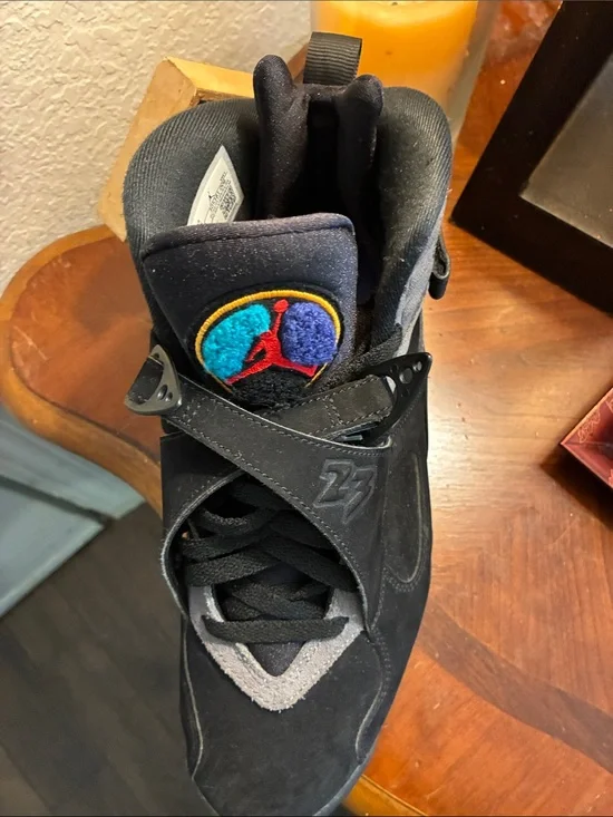 Jordan Men's Black High-Top Sneakers with Teal & Purple Logo Accent