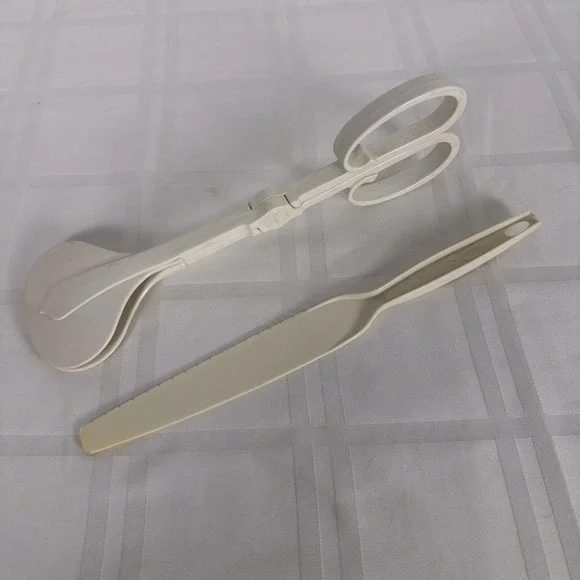 Retro White Kitchen‎ utensils: Dansk salad tongs, Foley cake knife.