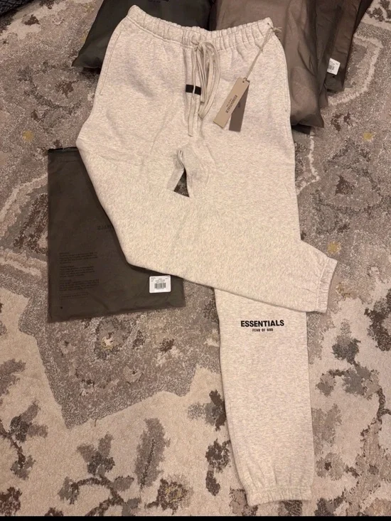 Brand new Essentials light oatmeal cuffed sweatpants with tags and original bag