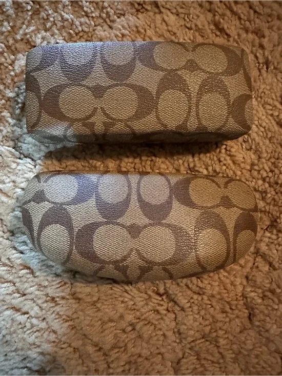 A set of two Coach Signature Canvas Sunglasses Cases in Khaki and Brown