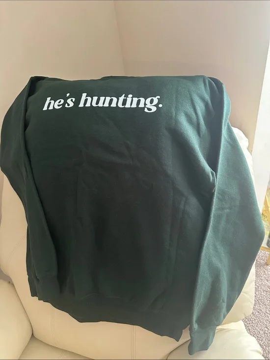 Who’s Hunting…get comfy in this money green Gildan sweatshirt, always on trend.