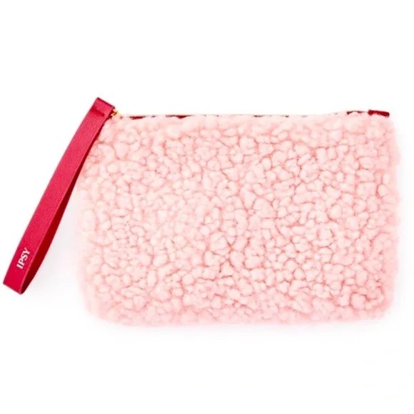 Fuzzy pink‎ makeup bag with maroon zipper pull and inner lining IPSY