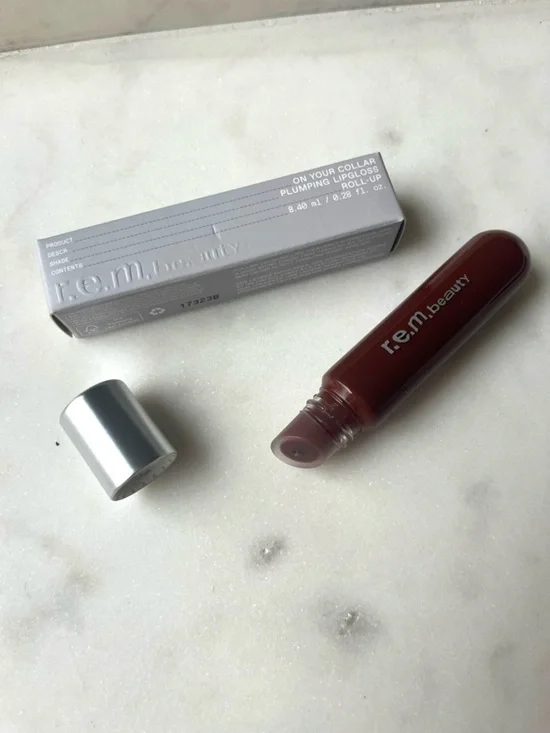 r.e.m. beauty by Ariana Grande, On Your Collar Plumping Lip Gloss “Rollup” Shade
